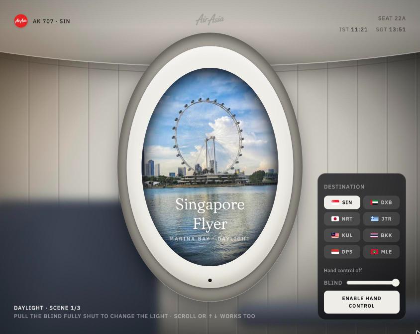 AirAsia Seat 22A WebGL website built in Cursor, showing the Singapore Flyer seen through an aircraft window